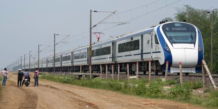 Balasore: Vande Bharat Express passes by the site where the recent triple-train accident happened, near Bahanaga Bazar railway station after train service resumes, in Balasore district, Wednesday, June 7, 2023. (PTI Photo/Swapan Mahapatra)(PTI06_07_2023_000070B)